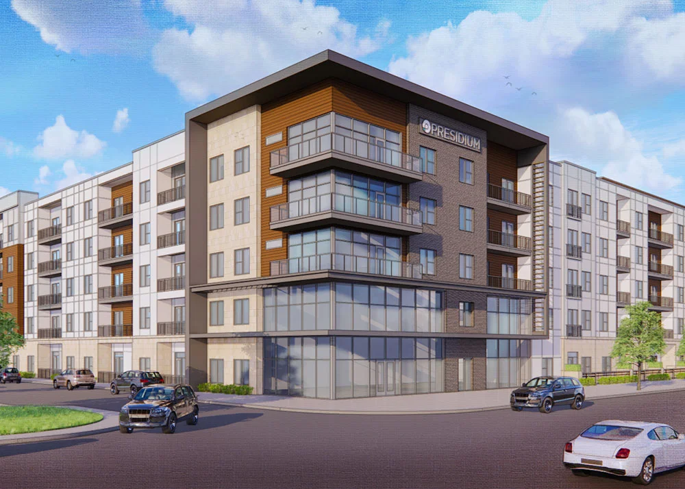 Exterior corner of Presidium Valley View with boxy modern architecture, and a mix of brick and large floor to ceiling windows.
